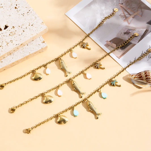 Bracelet doré charms marins avec palmier et pierres