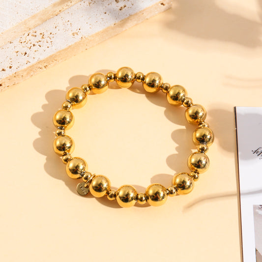 Bracelet élastique à grosses billes polies