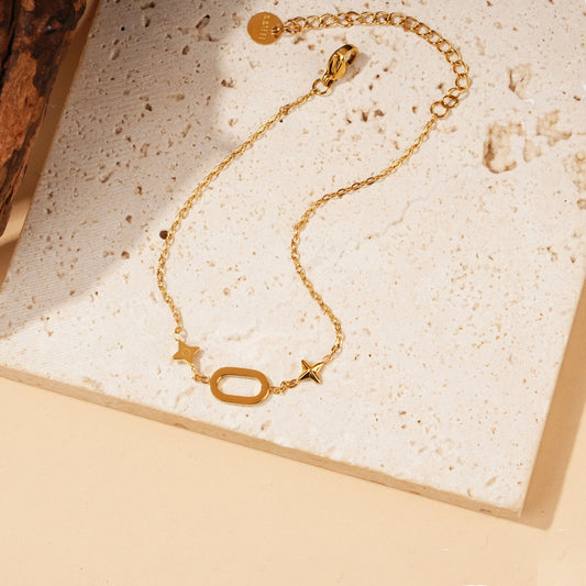 Bracelet chaîne dorée ovale et double étoiles