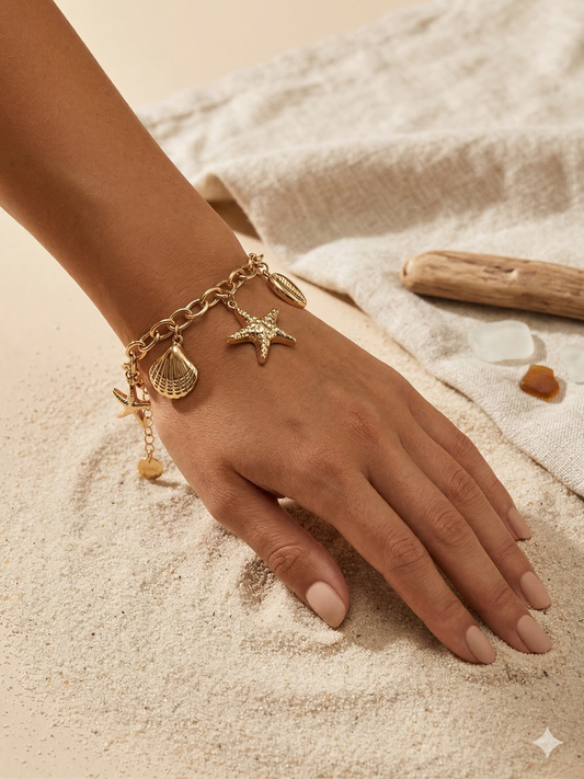 Bracelet doré charms étoiles de mer et coquillages