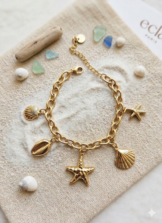 Bracelet doré charms étoiles de mer et coquillages