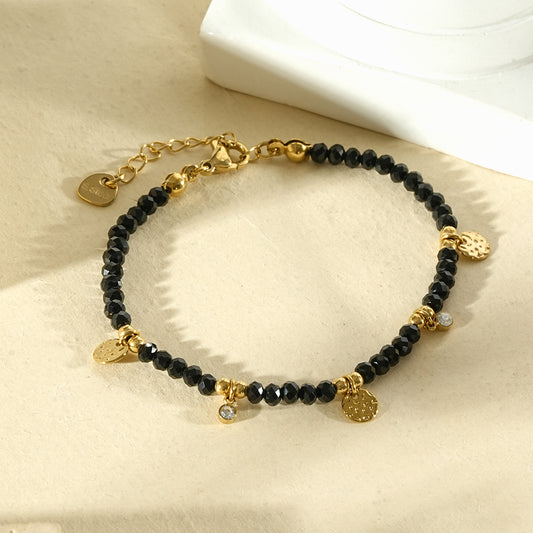 Bracelet pierres noires breloques sertie