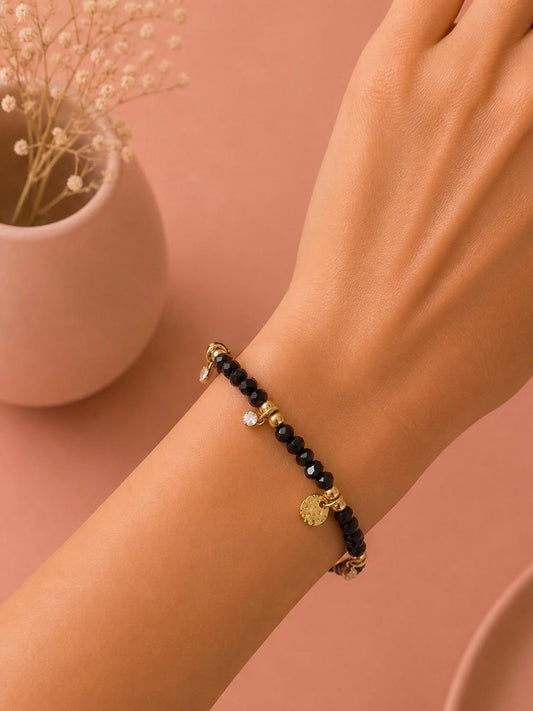 Bracelet pierres noires breloques sertie