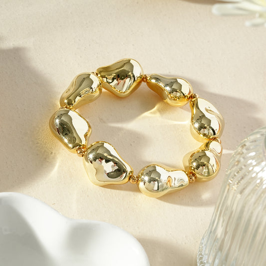 Bracelet doré élastique galets polis