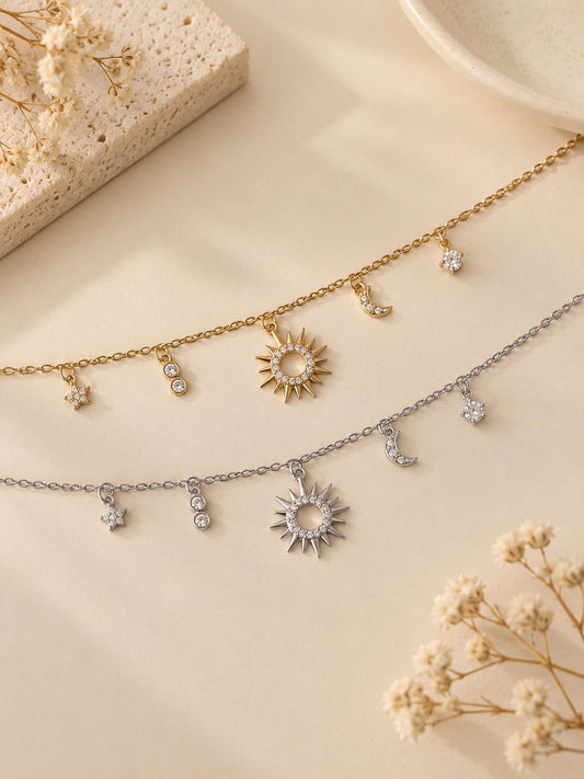 Bracelet chaîne fine avec breloques constellation
