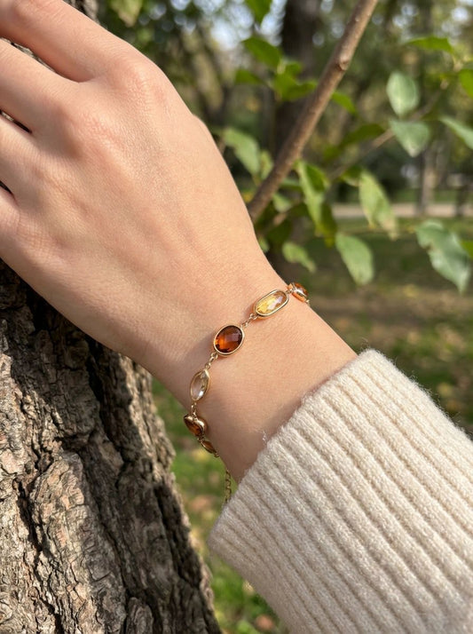 Bracelet strass marron et jaunes formes variées