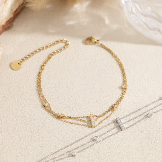 Bracelet multi chaînes reliées par une barre strass