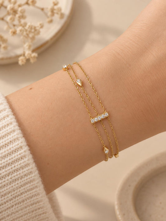 Bracelet multi chaînes reliées par une barre strass