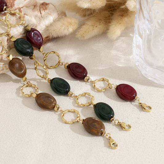 Bracelet anneaux torsadés perles résine