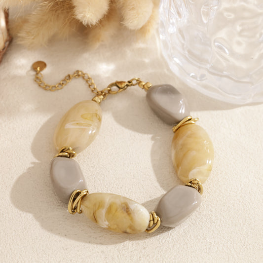 Bracelet perles ovales en résine marbrée