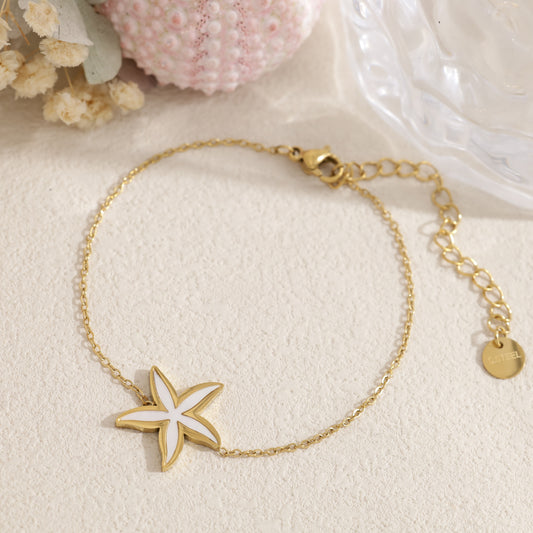 Bracelet doré étoile de mer pavée et nacrée