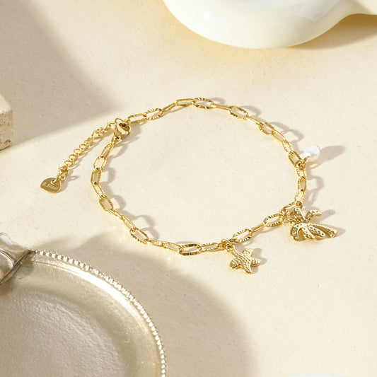 Chaîne de cheville dorée pendante palmier et étoile de mer