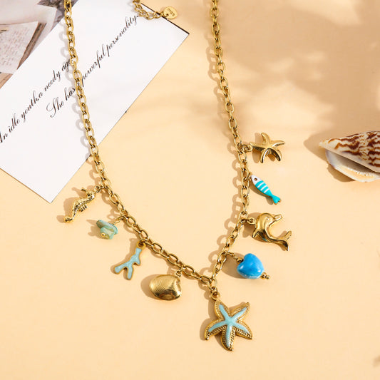 Collier doré charms étoile de mer, corail et cœur