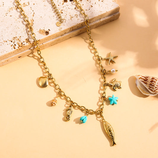 Collier doré à charms poisson et étoile de mer
