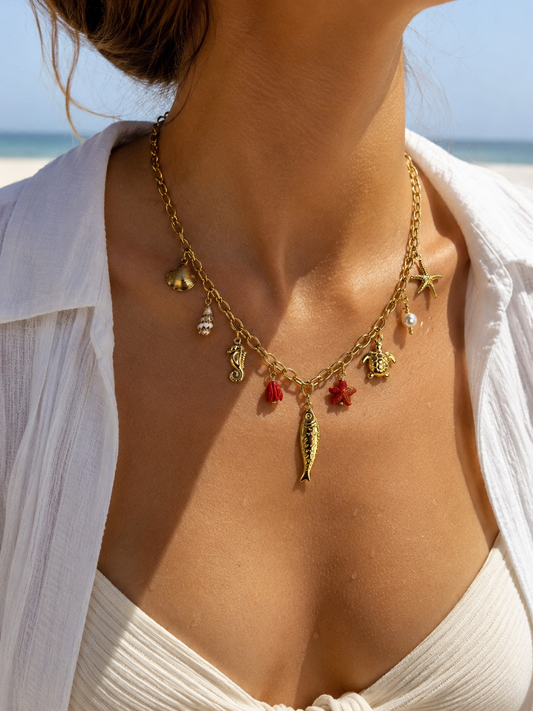 Collier doré à charms poisson et étoile de mer