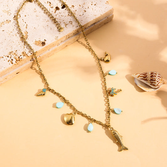 Collier doré charms marins avec palmier et pierres
