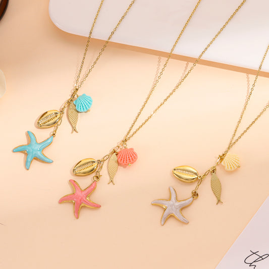 Collier doré pendant étoile de mer turquoise et coquillage