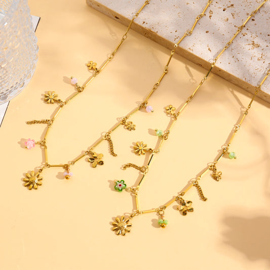 Collier doré fin à charms fleurs marguerites