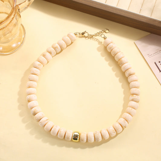 Collier perles rondes en résine marbrée