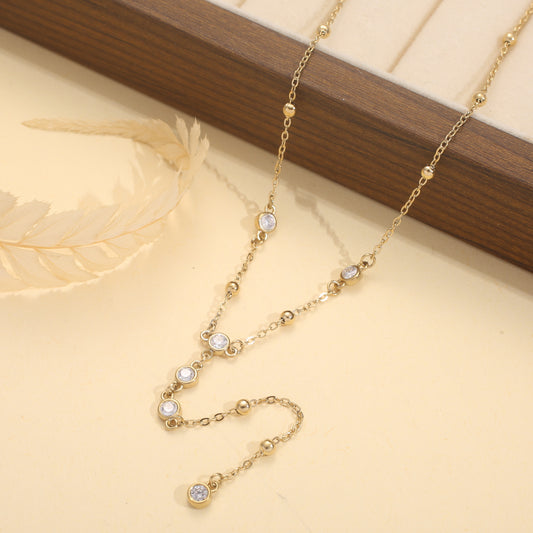 Collier doré en Y avec multiples strass ronds