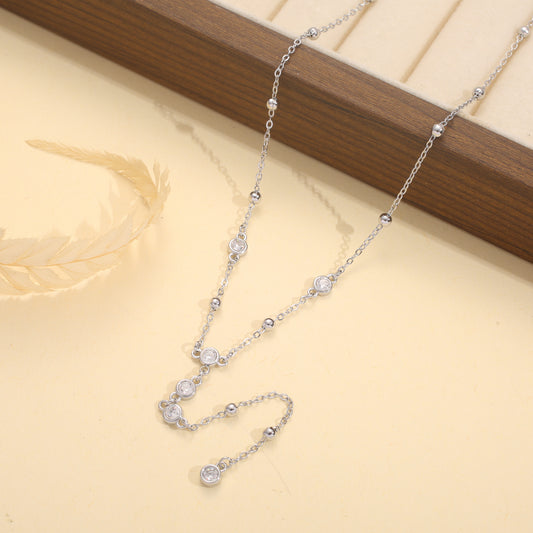 Collier doré en Y avec multiples strass ronds