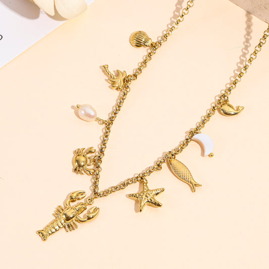 Collier doré charms homard, étoile et crabe avec perles