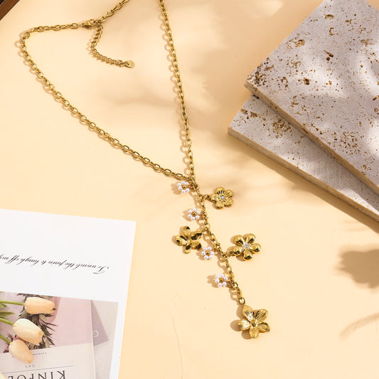 Collier doré en Y pendentifs fleurs avec strass central