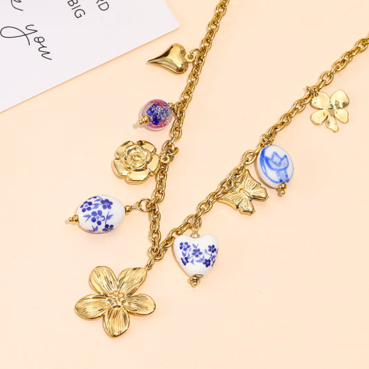 Collier doré multi-charms fleurs et breloques en porcelaine
