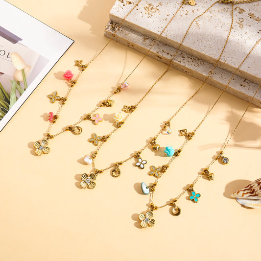 Collier doré charms trèfle serti et mini fleur
