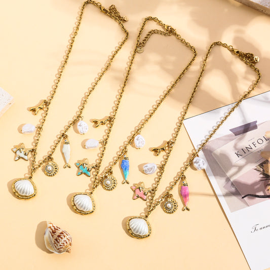 Collier doré coquillage perlé, étoile de mer et poisson