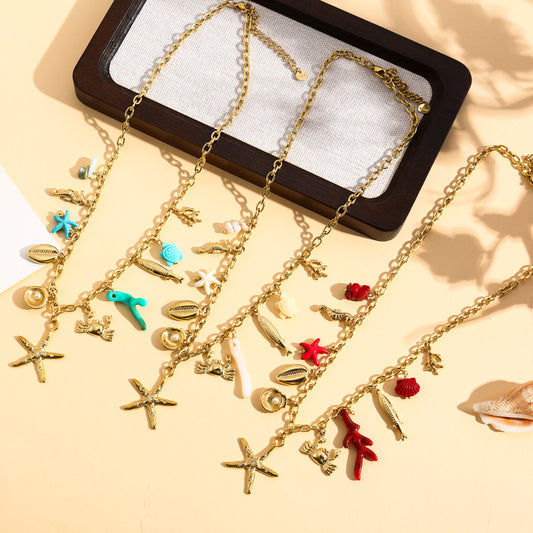 Collier doré charms marins, corail et étoile