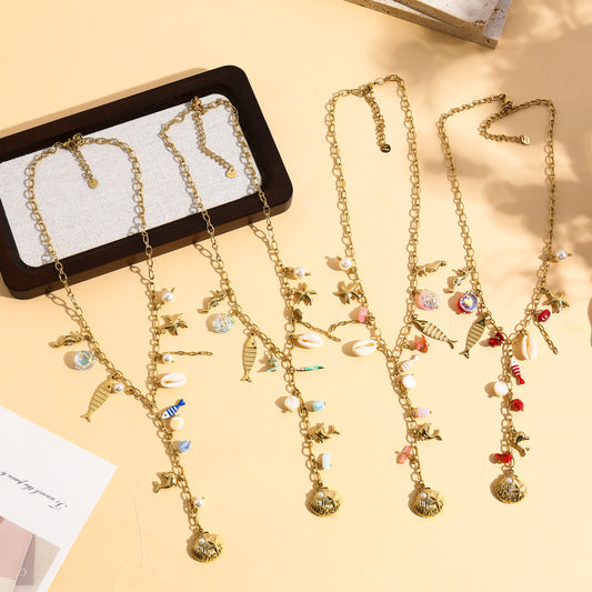 Collier doré en Y charms marins avec pierres et poisson