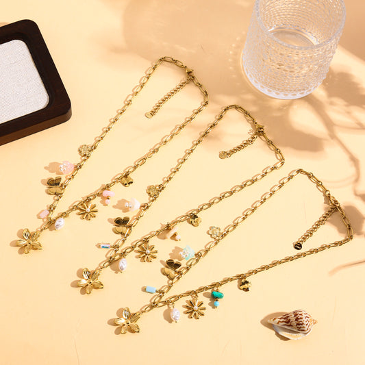 Collier doré à charms fleurs et muguet
