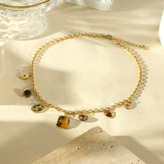 Collier breloques mixtes résine motif léopard