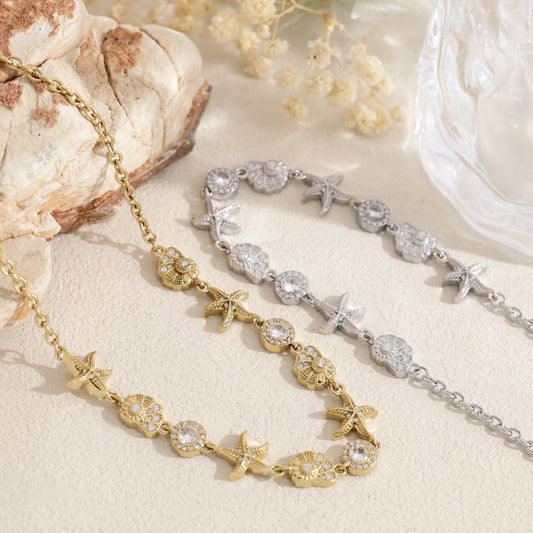 Collier doré étoile de mer, coquillage et strass rond
