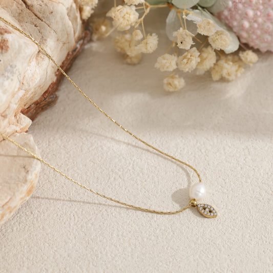 Collier perle d'eau douce et pampille œil strass