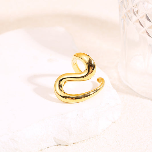 Bague dorée ouverte design ondulé et bombé finition miroir