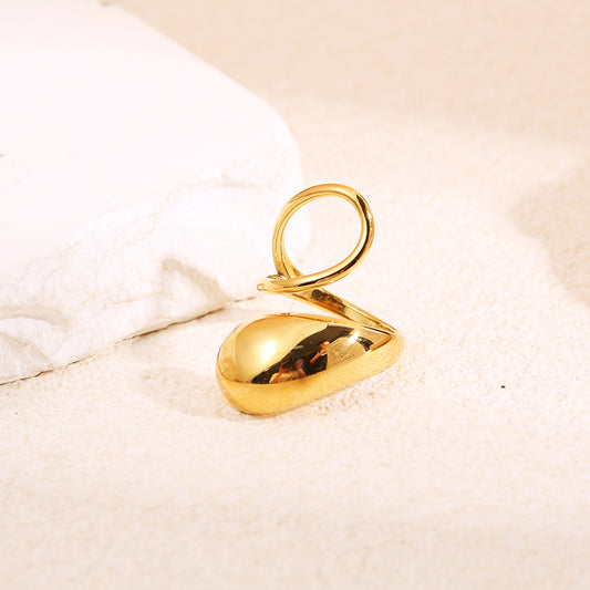 Bague dorée ajustable au design asymétrique avec large pastille bombée et anneau fin torsadé