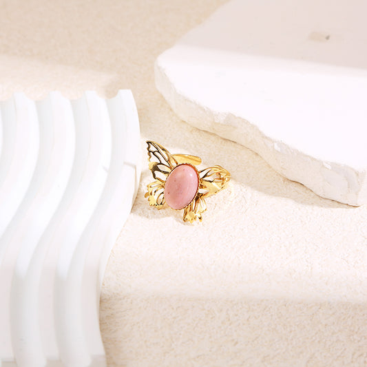 Bague dorée papillon pierre rose