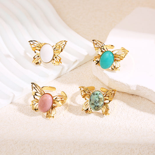 Bague papillon ajouré doré avec pierre turquoise africaine