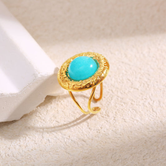 Bague Dorée Ajustable Cercle Texturé Entouré Avec Pierre Bleue