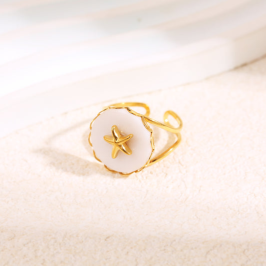 Bague dorée pierre blanche étoile de mer