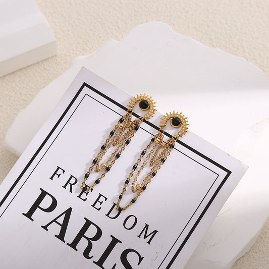 Boucles d'Oreilles Dorées Eclat Avec Pierres Noires Et Chaînes Noires