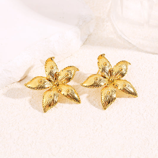 Boucles d'oreilles dorées fleur avec points