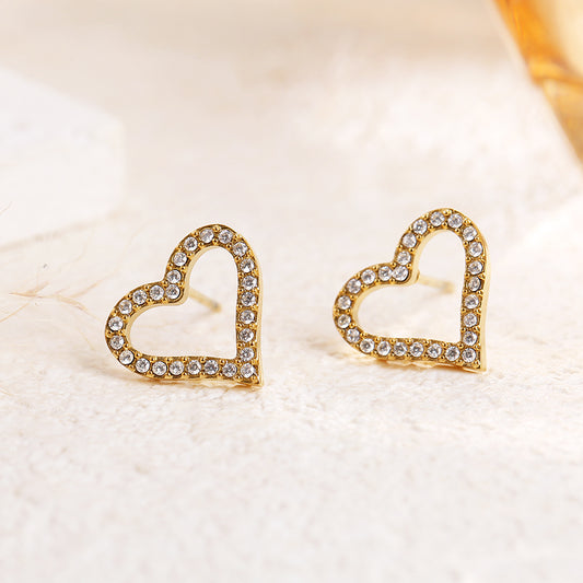 Boucles d'oreilles dorées cœurs ajourés strassés