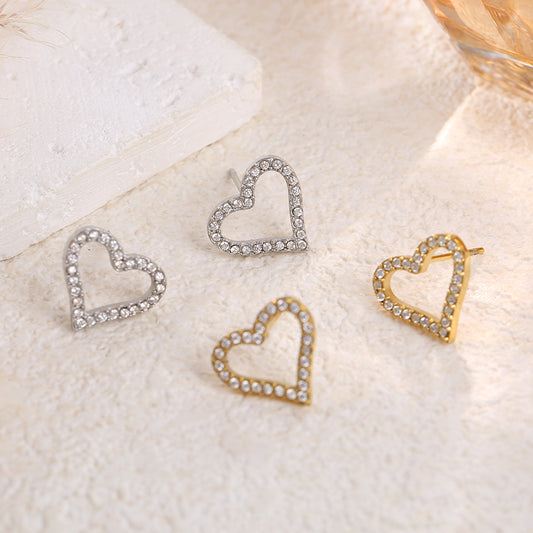 Boucles d'oreilles dorées cœurs ajourés strassés