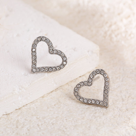 Boucles d'oreilles argentées cœurs ajourés et strassés