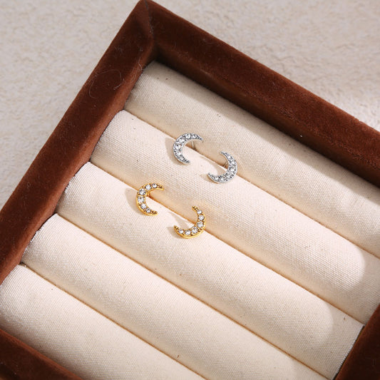 Clous d'Oreilles Argentés Demi Lune Strassé