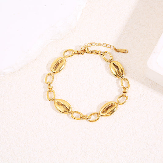 Bracelet chaîne dorée avec 4 coquillages dorées
