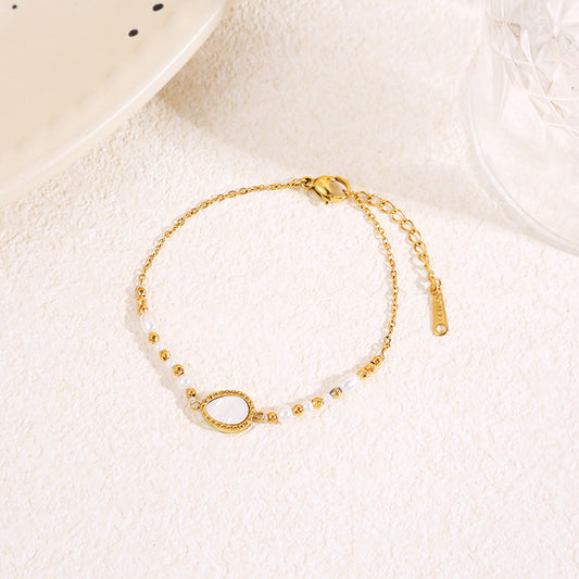 Bracelet doré avec nacre en goutte